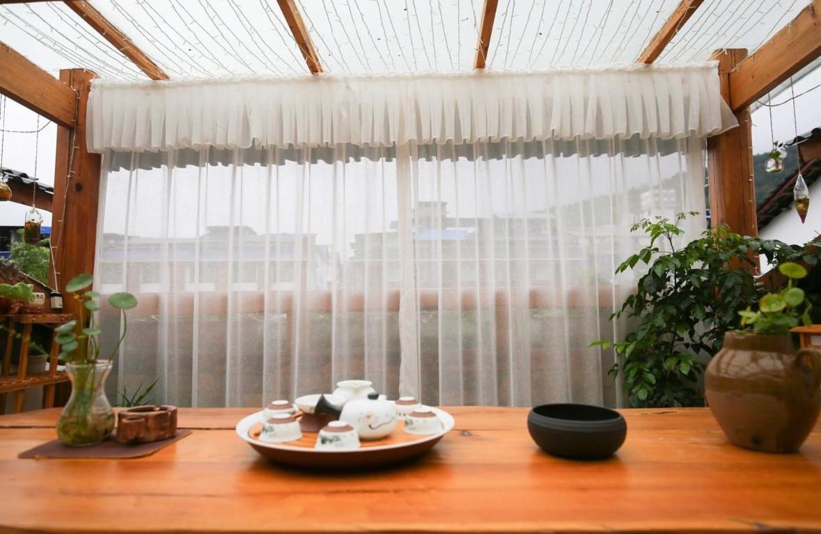 Tea House Hotel Zhangjiajie Buitenkant foto